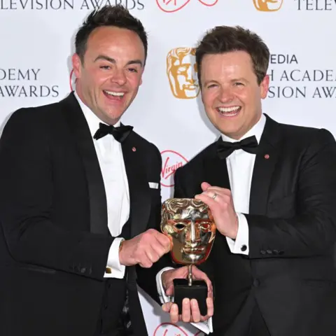 Getty Images Ant and Dec holding a bafta