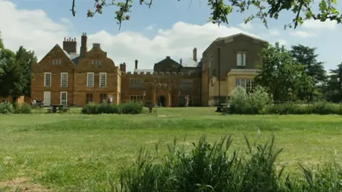 A stately home at the end of green space