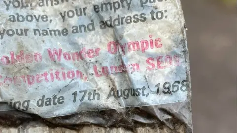 Rubbish Walks Back of an old crisp packet