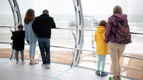 Getty Images Visitors in the i360 in Brighton