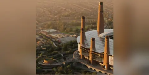 Birmingham City Parte del estadio está bañada por la luz del sol en una vista aérea. Se ven cinco torres con turbas caminando por el suelo y alrededor de una sección circular a la izquierda.