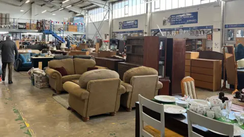 Furniture, plates and other items in the St Vincent's superstore.