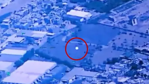Image shows a UFO with a red circle around it.