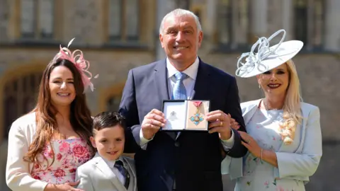 PA  Peter Shilton with his wife Steph Shilton and son and daughter at Windsor Castle