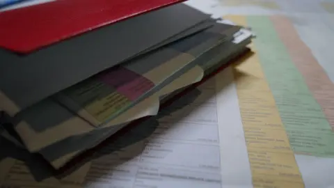 Anaachitis Sachdev/BBC Anjali folder, where she made a list of documents to track her money after digital arrest. 