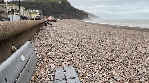 Seaton Town Council Benches under shingles on Seaton beach. 