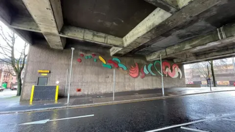 A wider shot of Traffic Flow from across the road.