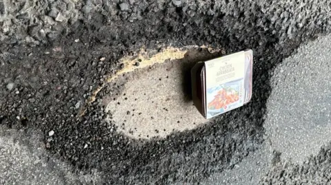 A ready meal in a pothole