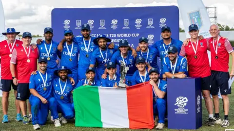 Italy's players celebrate victory in the European sub-regional qualifier for the 2026 T20 World Cup