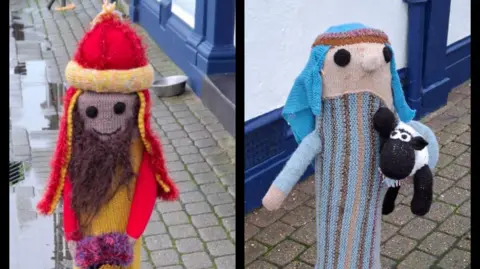 The Knitoholics A collage with three photos next to each other. The pictures show knitted covers placed over bollards depicting characters from the nativity. This picture shows one of the kings and a shepherd.