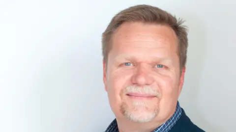 Dorothy House Head and shoulders picture of Dorothy House Hospice Care CEO Wayne de Leeuw.