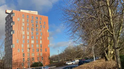 Photograph of Christabel tower block in Manchester on a sunny day.