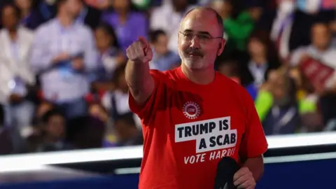 Reuters Shawn Fain wearing a "Trump is a Scab" shirt