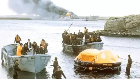 PA Survivors coming ashore from the bombed Sir Galahad