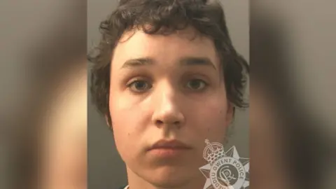 Owain Roberts mug shot. He has brown hair and looking directly at the camera. 