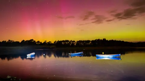 Connor Madden  A reservoir with three boats 