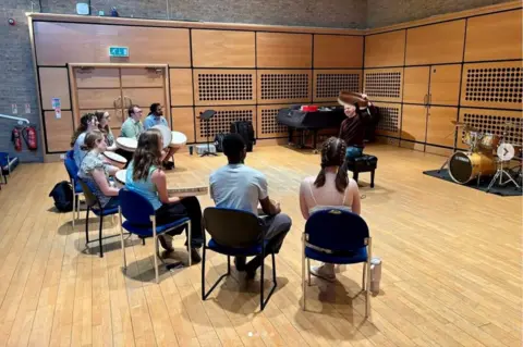 University of Nottingham Department of Music Music students taking part in a performance workshop with bodhran player Cormac Byrne