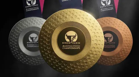 Birmingham 2026 An image of the gold, silver and bronze medals with the Birmingham 2026 logo on and black and pink ribbons