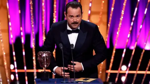 Getty Images Danny Dyer accepts the Male Performance in a Comedy Programme Award for 'Mr Bigstuff' during the 2025 BAFTA Television Awards with P&O Cruises Ceremony at The Royal Festival Hall on May 11, 2025 in London, England.