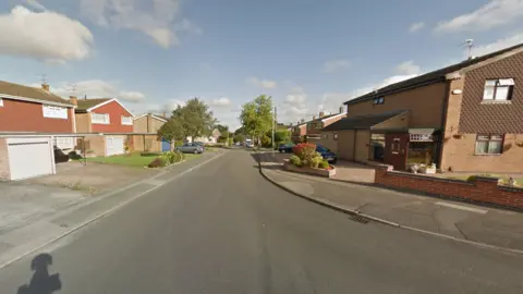 A sub-urban street junction in the sunshine 