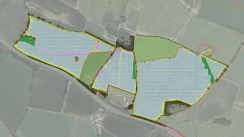 Wood Lodge Solar Project An aerial view of the site of the solar farm showing three adjacent fields outlined in yellow and A14 road alongside the southern edge.