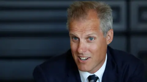 Getty Images Ed Smith, during his time as national selector. He has short greying hair, blue eyes and is wearing a blue blazer and tie over a white shirt.
