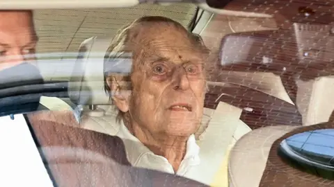Daniel Leal/AFP via Getty Images A photograph of Prince Philip in the back of a car looking tired