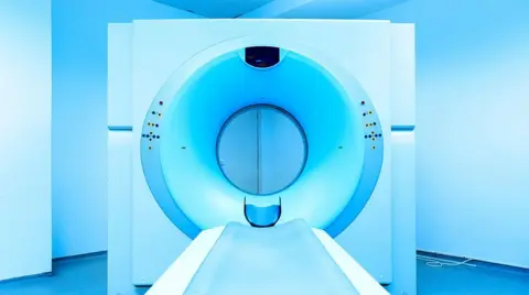 Getty Images A CT scanner - a furniture  successful  beforehand   of a achromatic  instrumentality   which has a circular spread   successful  the mediate  wherever  the diligent  is scanned