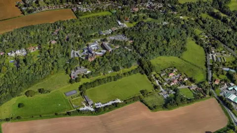 Surrey Police and Crime Commissioner The current Mount Browne site pictured from the air, surrounded by green fields. 