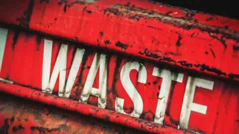 Getty Images Red waste skip