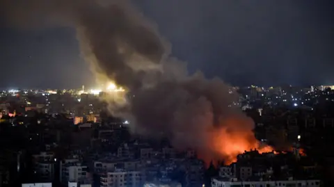  EPA-EFE/REX/Shutterstock Smoke billows over Beirut following Israeli strikes on the Lebanese capital. Photo: 7 October 2024