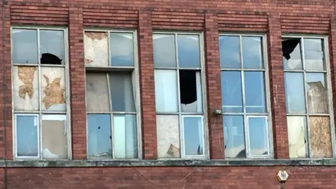 Broken windows on the North Mill
