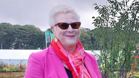 Royal National Institute of Blind People Anna Tylor wearing a pink blazor