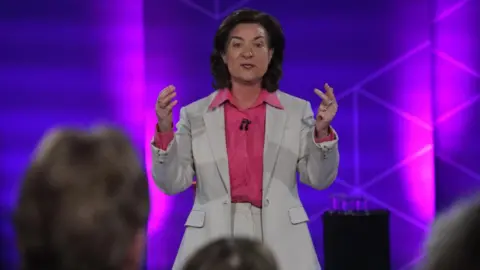 Eluned Morgan addressing the audience