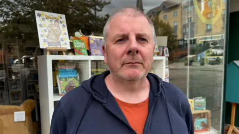 Jeff Baxter in front of his bookshop