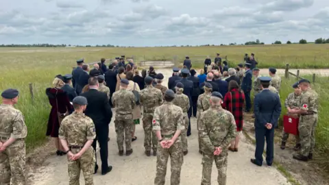 A crowd gather for the ceremony