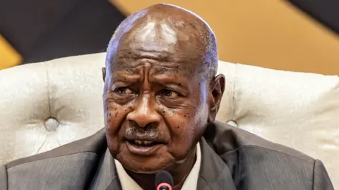 President of Uganda and Chairman of the Non-Aligned Movement (NAM) Yoweri Museveni delivers his speech during the closing session of the 19th Summit of Heads of State and Government of the Non-Aligned Movement in Kampala on January 20, 2024. 