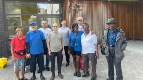 A line-up of people involved in the centre.