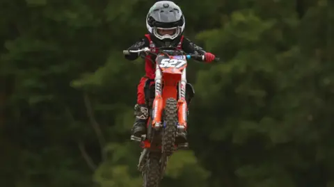 Paul Simpson Cooper on his motocross bike