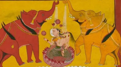 Gouache painting on paper depicting Gaja-Lakṣmī (Gajalakshmi); an image of the goddess Lakṣmī, who reigns over fertility and good fortune, seated on a lotus with an elephant (gajah in Sanskrit) on either side. They have small wings, a detail which recalls the myth in which the elephants freely roamed throughout the sky.
