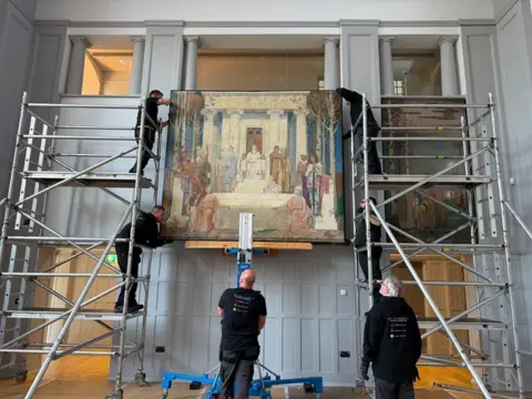 Amber Valley Borough Council Men with scaffolding around artwork.