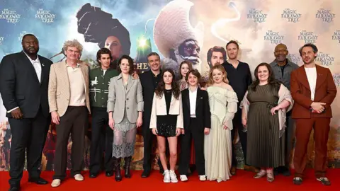 Getty Images (L-R) Nonso Anozie, Simon Farnaby, Andrew Garfield, Claire Foy, Ben Gregor, Billie Gadsdon, Delilah Bennett-Cardy, Phoenix Laroche, Nicola Coughlan, Oliver Chris, Jessica Gunning, Sir Lenny Henry and Dustin Demri-Burns attend "The Magic Faraway Tree" UK special screening at Odeon Luxe Leicester Square on March 22, 2026 in London, England