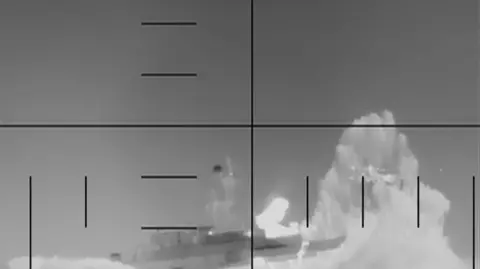 Still image of the moment a US torpedo struck an Iranian naval ship in the Indian Ocean on 04 March 2026.