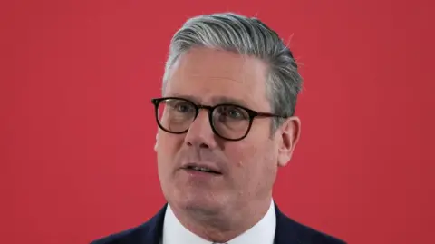 Carlos Jasso/Reuters Sir Keir Starmer wearing glasses