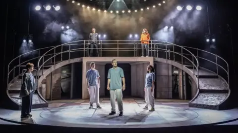 Nottingham Playhouse/Marc Brenner The cast of Punch on a set designed like a pedestrian subway in Nottingham