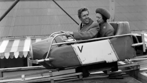 Getty Images Princess Margaret is in a ride carriage in a black and white photo from 1965.