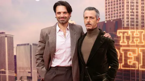 Reuters crew members Sebastian Stan and Jeremy Strong pose during the presentation of The Apprentice at the BFI London Film Festival 