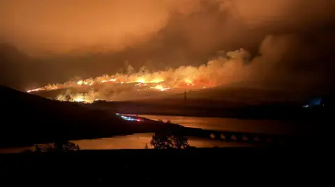 Wildfire off the Woodhead Pass at Woodhead Reservoir, near Glossop, in the Peak District, Derbyshire, on Wednesday 22 April.

