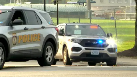Two police cars with flashing lights on at VSU