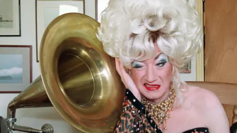 PA Media Paul O'Grady as drag act Lily Savage